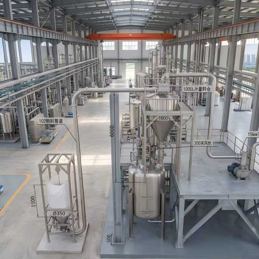 Big bag unloader connected to vacuum conveyor for fully automated material transfer
